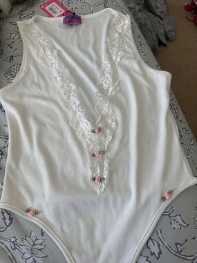 Edikted White Lace-Trim Bodysuit with Pink Rose Accents